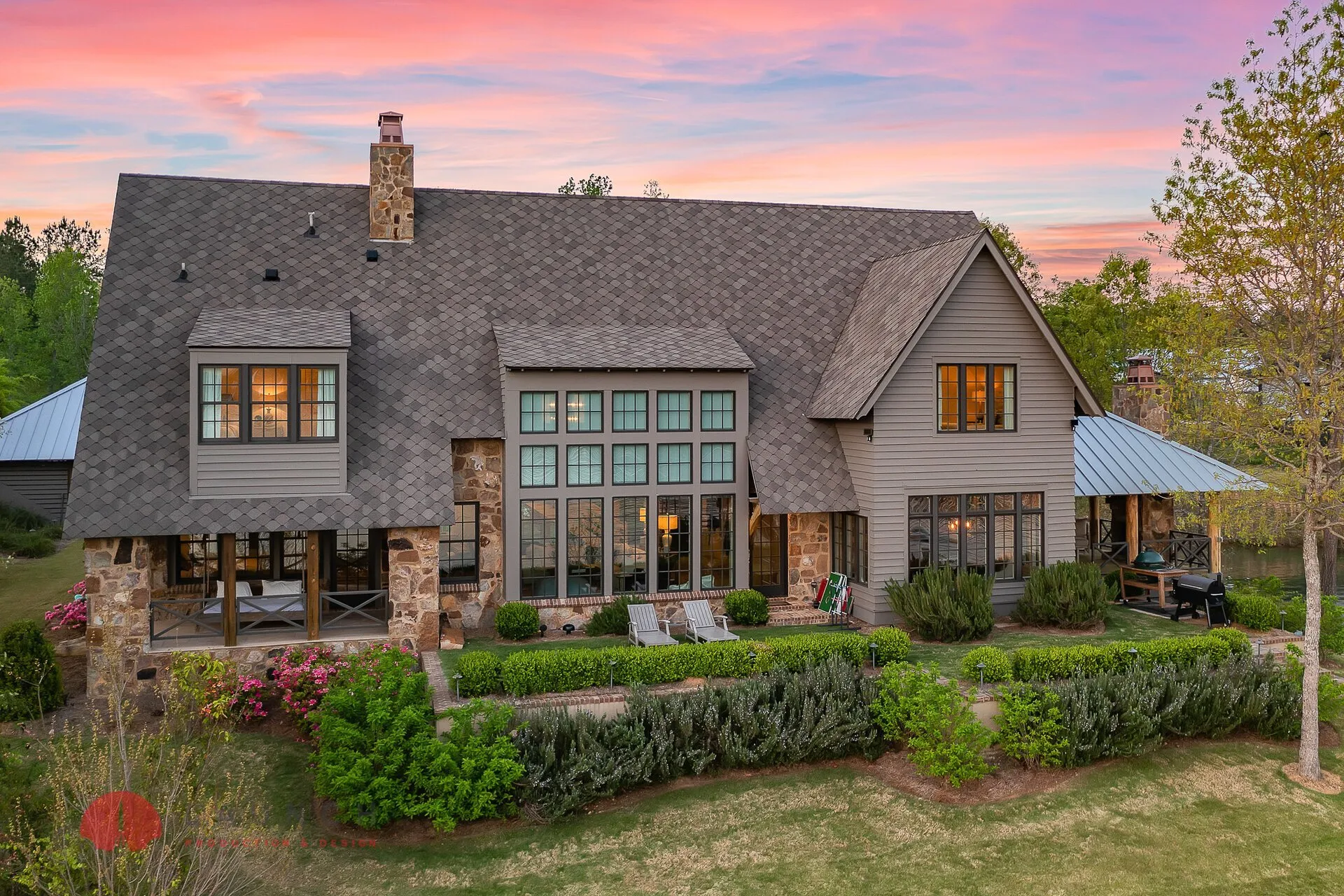 Drone photography showing a luxury home from a 45-degree aerial angle with roof and yard visible
